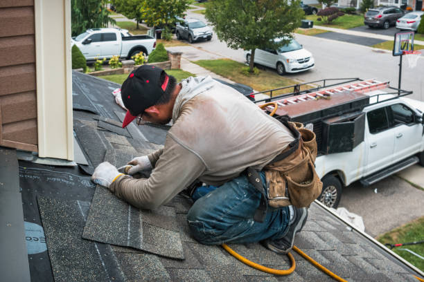 Professional Roofing technician working in Henderson, IA